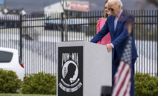 President Joe Biden, and Scranton Mayor Paige Cognetti, pause at a Scranton war memorial, Wednesday, April 17, 2024, in Scranton, Pa. (AP Photo/Alex Brandon)