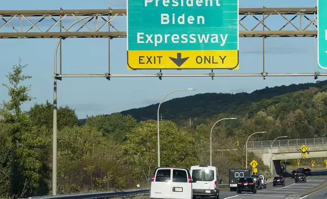 FILE - The motorcade of President Joe Biden passes underneath a sign for the newly renamed President Biden Expressway on the way to Scranton, Pa., Oct. 20, 2021. Biden will return to his childhood hometown of Scranton on Tuesday, April 16, 2024, to kick off three straight days of campaigning in Pennsylvania, capitalizing on the opportunity to crisscross the battleground state while Donald Trump spends the week in a New York City courtroom for his first criminal trial. (AP Photo/Susan Walsh, File)