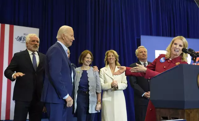 Kerry Kennedy, right, introduces President Joe Biden, second from left, at a campaign event, Thursday, April 18, 2024, in Philadelphia. Pictured from left are members of the Kennedy family Maxwell Kennedy Sr., Kathleen Kennedy Townsend, Rory Kennedy and Christopher Kennedy. (AP Photo/Alex Brandon)