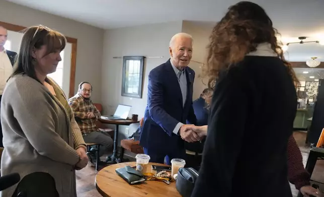 President Joe Biden greets patrons at Zummo's Cafe, Wednesday morning, April 17, 2024, in Scranton, Pa. (AP Photo/Alex Brandon)