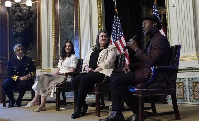 Singer-songwriter Aloe Blacc speaks, right, speaks during an event on the White House complex in Washington, Tuesday, April 23, 2024, with notable suicide prevention advocates. He is joined by, from left, Surgeon General Dr. Vivek Murthy, Ashley Judd, and Shelby Rowe, Executive Director of the Suicide Prevention Research Center. The White House held the event on the day they released the 2024 National Strategy for Suicide Prevention to highlight efforts to tackle the mental health crisis and beat the overdose crisis. (AP Photo/Susan Walsh)
