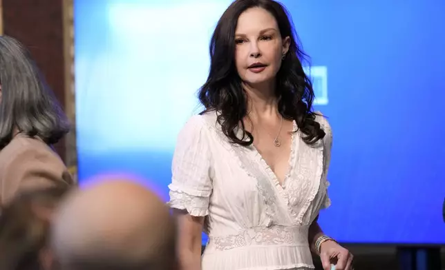 Ashley Judd heads to her seat before the start of an event on the White House complex in Washington, Tuesday, April 23, 2024, with notable suicide prevention advocates. The White House held the event on the day they released the 2024 National Strategy for Suicide Prevention to highlight efforts to tackle the mental health crisis and beat the overdose crisis. (AP Photo/Susan Walsh)