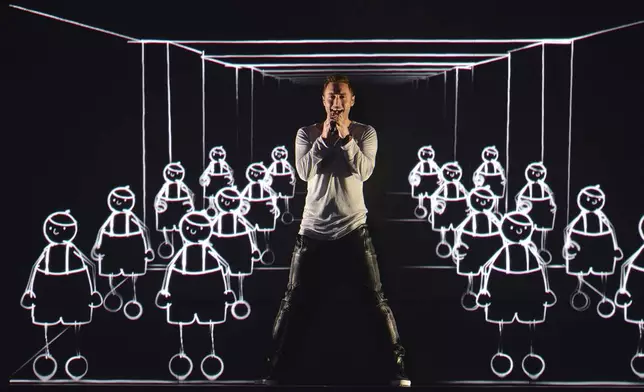 FILE - Sweden's Mans Zelmerlow performs the song 'Heroes' during a dress rehearsal for the second semifinal of the Eurovision Song Contest in Austria's capital Vienna, May 20, 2015. The 68th Eurovision Song Contest is taking place in May in Malmö, Sweden. It will see acts from 37 countries vie for the continent’s pop crown. Founded in 1956, Eurovision is a feelgood extravaganza that strives to banish international strife and division. It’s known for songs that range from anthemic to extremely silly, often with elaborate costumes and spectacular staging. (AP Photo/Kerstin Joensson, File)