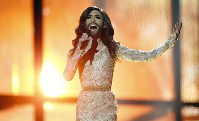 FILE - Conchita Wurst representing Austria performs the song ' Rise Like a Phoenix' during a rehearsal for the second semifinal of the Eurovision Song Contest in the B&amp;W Halls in Copenhagen, Denmark, May 7, 2014. The 68th Eurovision Song Contest is taking place in May in Malmö, Sweden. It will see acts from 37 countries vie for the continent’s pop crown. Founded in 1956, Eurovision is a feelgood extravaganza that strives to banish international strife and division. It’s known for songs that range from anthemic to extremely silly, often with elaborate costumes and spectacular staging. (AP Photo/Frank Augstein, file)