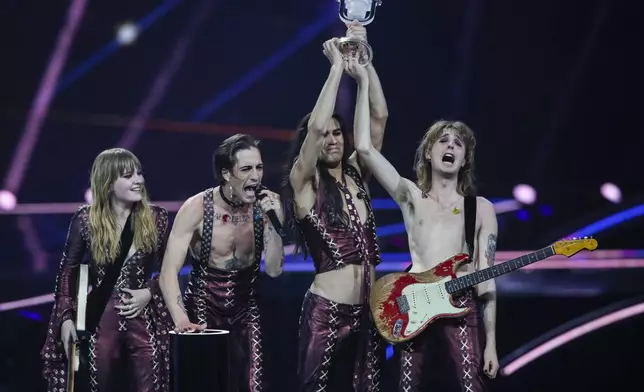 FILE - Maneskin from Italy receive the trophy after winning the Grand Final of the Eurovision Song Contest at Ahoy arena in Rotterdam, Netherlands, May 22, 2021. The 68th Eurovision Song Contest is taking place in May in Malmö, Sweden. It will see acts from 37 countries vie for the continent’s pop crown. Founded in 1956, Eurovision is a feelgood extravaganza that strives to banish international strife and division. It’s known for songs that range from anthemic to extremely silly, often with elaborate costumes and spectacular staging. (AP Photo/Peter Dejong, File)