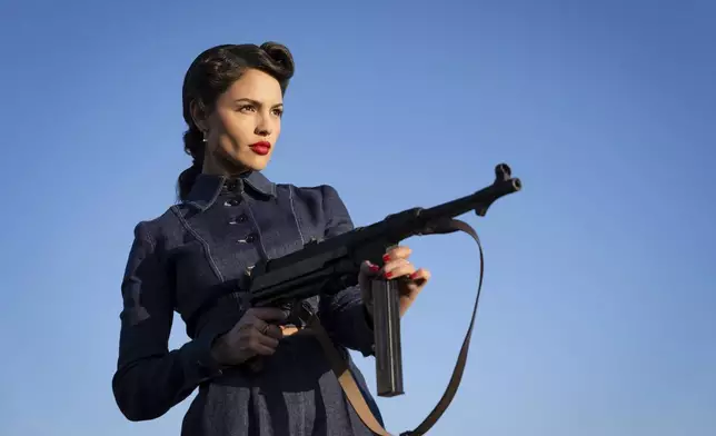 This image released by Lionsgate shows Eiza Gonzalez in a scene from the film "The Ministry of Ungentlemanly Warfare." (Daniel Smith/Lionsgate via AP)