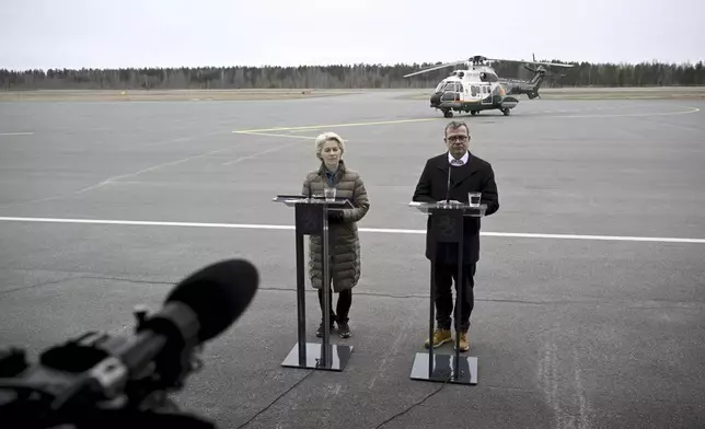 President of the European Commission Ursula von der Leyen, left, and Finnish Prime Minister Petter Orpo give a joint press conference at the Lappeenranta airport, eastern Finland, Friday April 19, 2024. President von der Leyen and Prime Minister Orpo visited the eastern border region of Finland on Friday and discussed what Finland and the EU can do to prevent instrumentalised migration to Finland's eastern border. (Antti Aimo-Koivisto/Lehtikuva via AP)