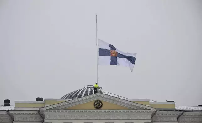 National flag of Finland flies at half-mast outside Government Palace by Senate Square in Helsinki, Finland Wednesday, April 3, 2024. A 12-year-old student opened fire at a secondary school in southern Finland on Tuesday morning, killing one and seriously wounded two other students, police said. The suspect was later arrested. (Antti Aimo-Koivisto/Lehtikuva via AP)