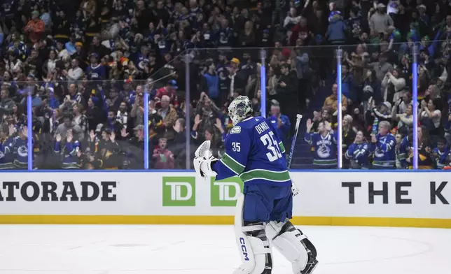 Vancouver Canucks goalie Thatcher Demko celebrates after the team's win over the Calgary Flames in an NHL hockey game Tuesday, April 16, 2024, in Vancouver, British Columbia. (Darryl Dyck/The Canadian Press via AP)