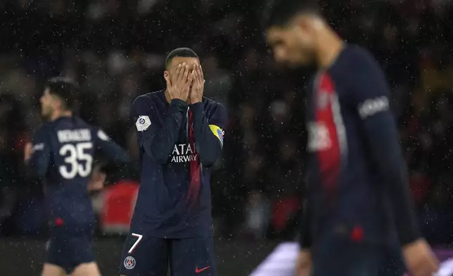 PSG's Kylian Mbappe reacts during the French League One soccer match between Paris Saint-Germain and Le Havre at the Parc des Princes in Paris, Saturday, April 27, 2024. (AP Photo/Thibault Camus)