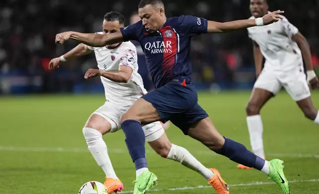 PSG's Kylian Mbappe competes for the ball during the French League One soccer match between Paris Saint-Germain and Clermont at the Parc des Princes stadium in Paris, Saturday, April 6, 2024. (AP Photo/Lewis Joly)