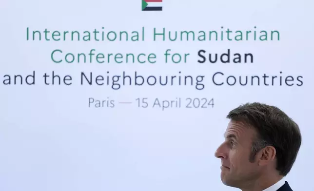 French President Emmanuel Macron attends a session at the international conference on Sudan, Monday, April 15, 2024 in Paris. Top diplomats and aid groups met in the French capital to drum up humanitarian support for Sudan after a yearlong war has devastated the northeastern African country and pushed its people to the brink of famine. (AP Photo/Aurelien Morissard; Pool)