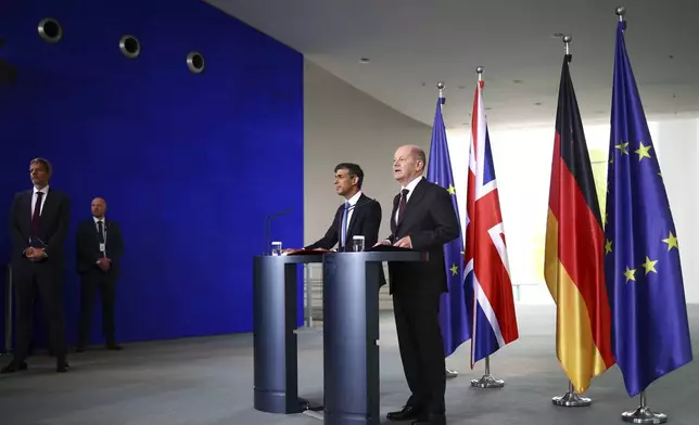 German Chancellor Olaf Scholz, right, and Britain's Prime Minister Rishi Sunak give a joint press conference at the Chancellery in Berlin, Wednesday April 24, 2024. (Henry Nicholls/Pool via AP)