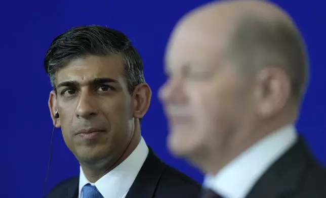 Britain's Prime Minister Rishi Sunak, left, listens to German Chancellor Olaf Scholz during a press conference in Berlin, Germany, Wednesday, April 24, 2024.(AP Photo/Alastair Grant, Pool)