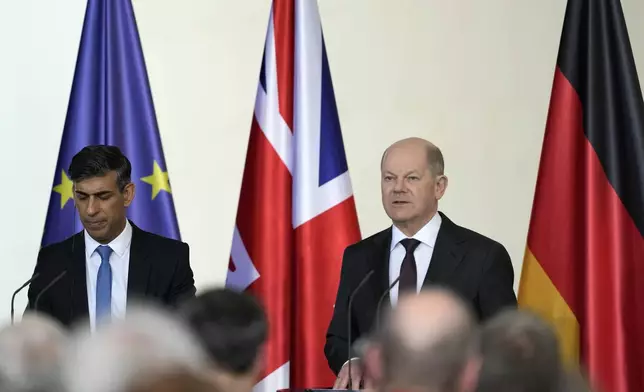 Britain's Prime Minister Rishi Sunak, left, and German Chancellor Olaf Scholz address the media during a press conference in Berlin, Germany, Wednesday, April 24, 2024.(AP Photo/Alastair Grant, Pool)