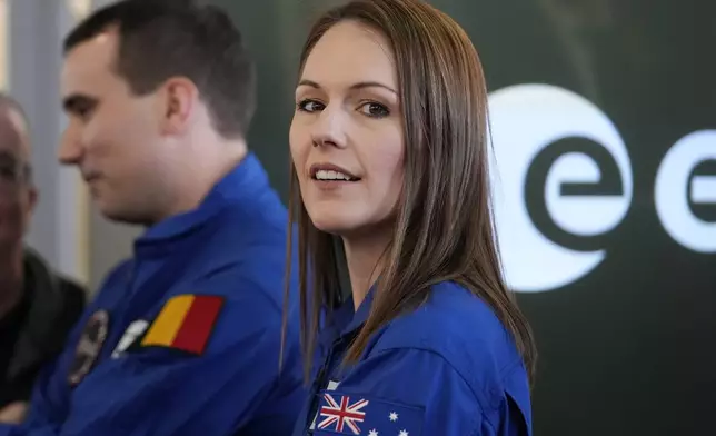 Astronaut Katherine Bennell-Pegg of Australia smiles during the candidates of the Class of 2022 graduation ceremony at the European Astronaut Centre in Cologne, Germany, Monday, April 22, 2024. ESA astronaut candidates Sophie Adenot of France, Pablo Alvarez Fernandez of Spain, Rosemary Coogan of Britain, Raphael Liegeois of Belgium and Marco Sieber of Switzerland took up duty at the European Astronaut Centre one year ago to be trained to the highest level of standards as specified by the International Space Station partners. Also concluding a year of astronaut basic training is Australian astronaut candidate Katherine Bennell-Pegg, who has trained alongside ESA's candidates. (AP Photo/Martin Meissner)