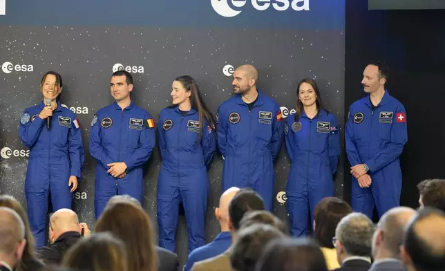 From left, Sophie Adenot of France, Raphael Liegeois of Belgium, Rosemary Cooga of Britain, Pablo Alvarez Fernandez of Spain, Katherine Bennell-Pegg of Australia and Marco Sieber of Switzerland, stand at the graduation ceremony of astronaut candidates of the Class of 2022 at the European Astronaut Centre in Cologne, Germany, Monday, April 22, 2024. The new ESA astronauts took up duty at the European Astronaut Centre one year ago to be trained to the highest level of standards as specified by the International Space Station partners. Also concluding a year of astronaut basic training is Australian astronaut candidate Katherine Bennell-Pegg, who has trained alongside ESA's candidates. (AP Photo/Martin Meissner)