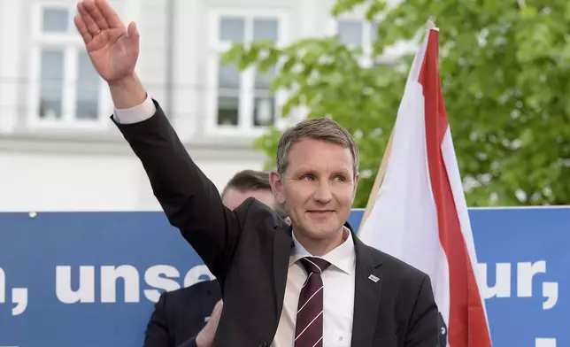 FILE - In this Wednesday, May 18, 2016 photo head of AfD in Thuringia, Bjoern Hoecke, smiles during a rally of the Alternative for Germany, AfD, party in Erfurt, eastern Germany. One of the most prominent figures in the far-right Alternative for Germany party is going on trial Thursday on charges of twice using a Nazi slogan, months before a regional election in which he is running to become his state’s governor. Bjoern Hoecke is the leader of the regional branch of Alternative for Germany, or AfD, in the eastern state of Thuringia. (AP Photo/Jens Meyer, File)
