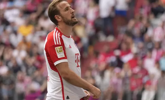 Bayern's Harry Kane reacts during the German Bundesliga soccer match between Bayern Munich and Cologne at the Allianz Arena in Munich, Germany, Saturday, April 13, 2024. (AP Photo/Matthias Schrader)