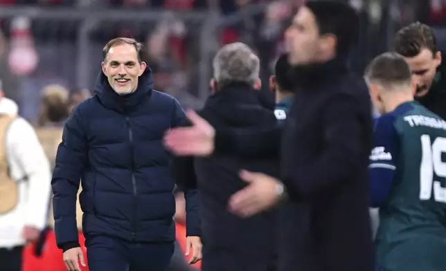 Bayern's head coach Thomas Tuchel, left, reacts during the Champions League quarter final second leg soccer match between Bayern Munich and Arsenal at the Allianz Arena in Munich, Germany, Wednesday, April 17, 2024. (AP Photo/Christian Bruna)