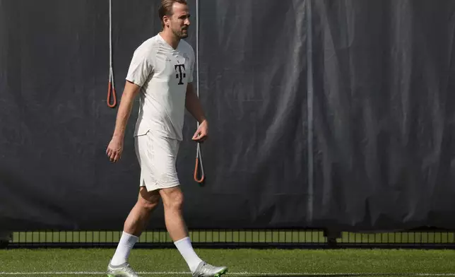 Bayern's Harry Kane arrives for a training session in Munich, Germany, Monday, April 29, 2024, ahead of the Champions League semi final first leg soccer match between FC Bayern Munich and Real Madrid. (AP Photo/Matthias Schrader)