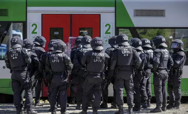 Hundreds of German local state police and federal police practice tactics in preparation for the European Championship in the village of Stützerbach, in Ilmenau, Germany, Tuesday, April 23, 2024. Germany hosts the European Championship from June 14 to July 14. Security is a priority with hundreds of thousands of fans expected for the 24-country soccer tournament. (AP Photo/Ebrahim Noroozi)