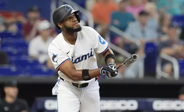 Miami Marlins' Bryan De La Cruz hits a home run during the sixth inning of a baseball game against the San Francisco Giants, Wednesday, April 17, 2024, in Miami. (AP Photo/Marta Lavandier)