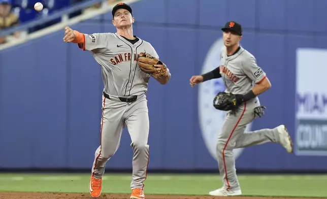 San Francisco Giants third baseman Matt Chapman (26) throws to first base for an out during the second inning of a baseball game against the Miami Marlins, Wednesday, April 17, 2024, in Miami. (AP Photo/Marta Lavandier)