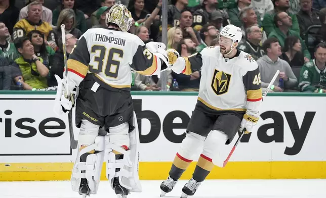 Vegas Golden Knights goaltender Logan Thompson (36) and center Tomas Hertl (48) celebrate after Hertl's goal in the first period in Game 1 of an NHL hockey Stanley Cup first-round playoff series against the Dallas Stars in Dallas, Monday, April 22, 2024. (AP Photo/Tony Gutierrez)