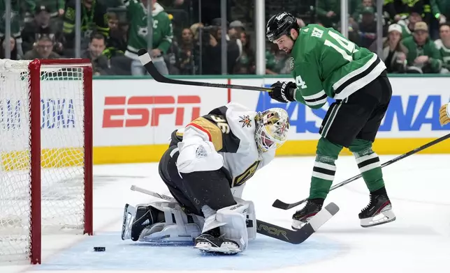Dallas Stars left wing Jamie Benn (14) scores against Vegas Golden Knights goaltender Logan Thompson (36) in the first period in Game 1 of an NHL hockey Stanley Cup first-round playoff series in Dallas, Monday, April 22, 2024. (AP Photo/Tony Gutierrez)