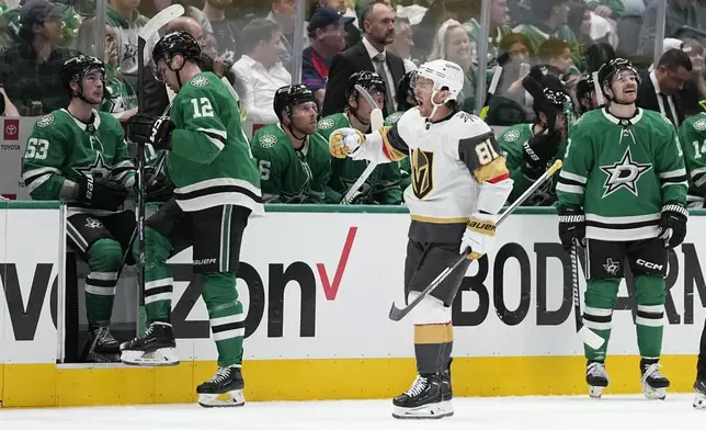 Vegas Golden Knights right wing Jonathan Marchessault (81) celebrates his first period goal in front of the Dallas Stars bench during Game 2 of an NHL hockey Stanley Cup first-round playoff series in Dallas, Wednesday, April 24, 2024. (AP Photo/Tony Gutierrez)