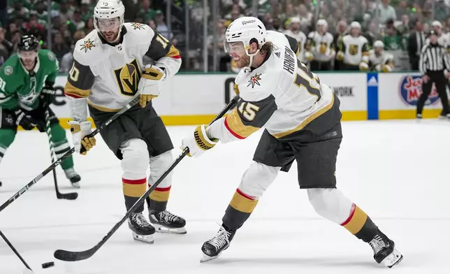 Vegas Golden Knights defenseman Noah Hanifin slaps a scoring shot against the Dallas Stars during the second period in Game 2 of an NHL hockey Stanley Cup first-round playoff series in Dallas, Wednesday, April 24, 2024. (AP Photo/Tony Gutierrez)