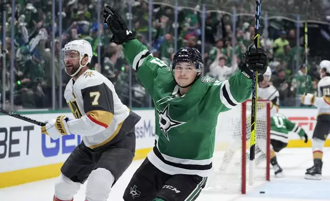 Dallas Stars left wing Jason Robertson (21) celebrates after his goal in front of Vegas Golden Knights' Alex Pietrangelo (7) in the first period in Game 1 of an NHL hockey Stanley Cup first-round playoff series in Dallas, Monday, April 22, 2024. (AP Photo/Tony Gutierrez)