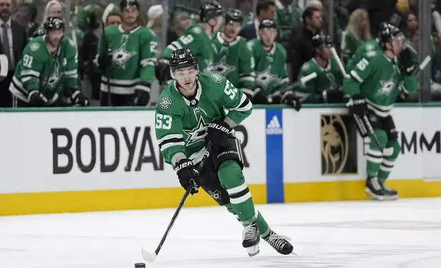 Dallas Stars center Wyatt Johnston skates with the puck against the Vegas Golden Knights during the first period in Game 2 of an NHL hockey Stanley Cup first-round playoff series in Dallas, Wednesday, April 24, 2024. (AP Photo/Tony Gutierrez)