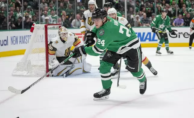Dallas Stars center Roope Hintz (24) chases the puck against the Vegas Golden Knights during the first period in Game 2 of an NHL hockey Stanley Cup first-round playoff series in Dallas, Wednesday, April 24, 2024. (AP Photo/Tony Gutierrez)