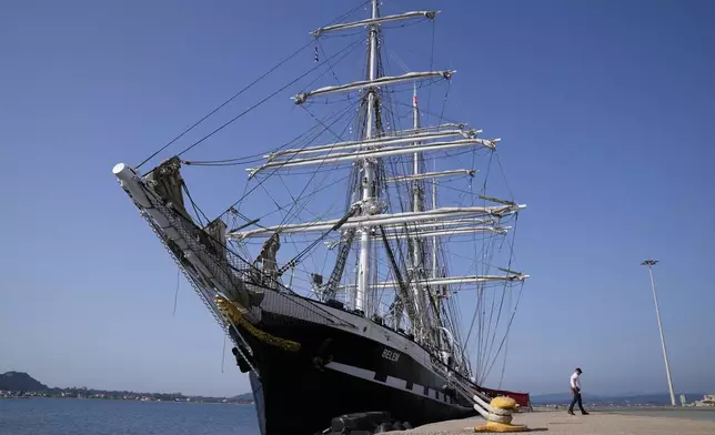 The Commandant of the historic Belem ship Aymeric Gibet, walks at the port of Katakolo, about 311 kilometers (194 miles) southwest of Athens, Greece, Monday, April 15, 2024. Built the same year the first modern Olympics were staged in Athens, in 1896, the Belem will carry the flame for the Paris games from the Greek capital's port of Piraeus to Marseille -- a former ancient Greek colony in southern France. (AP Photo/Thanassis Stavrakis)