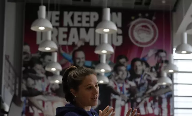 The two-time FIFA Player of the Year Carli Lloyd speaks to young migrants at Olympiacos Training Center in Athens, Monday, April 22, 2024. Elite American athletes and coaches, including the former US soccer players Carli Lloyd and Cobi Jones, take part in the 2024 spring roster of U.S. Soccer Sports Envoys organized by the U.S. Department of State. (AP Photo/Thanassis Stavrakis)