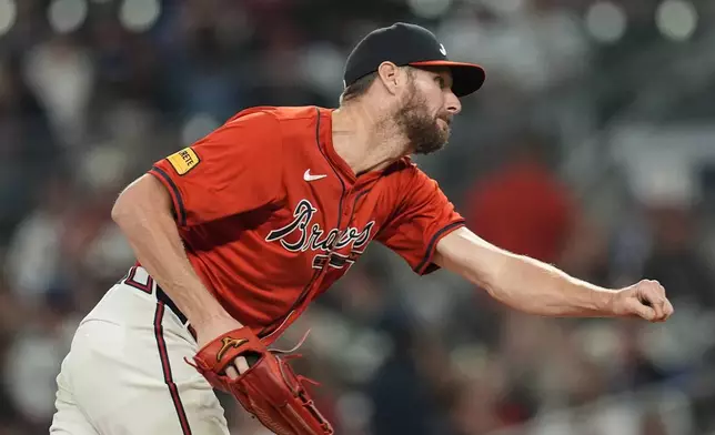 Atlanta Braves pitcher Chris Sale (51) delivers in the seventh inning against the Cleveland Guardians during a baseball game, Friday, April 26, 2024, in Atlanta. (AP Photo/Mike Stewart)