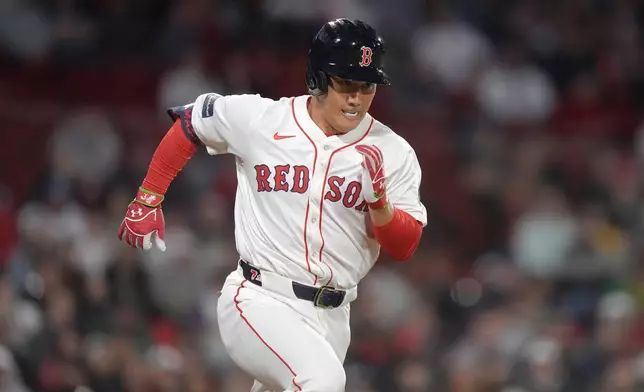 Boston Red Sox's Masataka Yoshida runs toward first as he grounds out in the ninth inning of a baseball game against the Cleveland Guardians, Tuesday, April 16, 2024, in Boston. (AP Photo/Steven Senne)