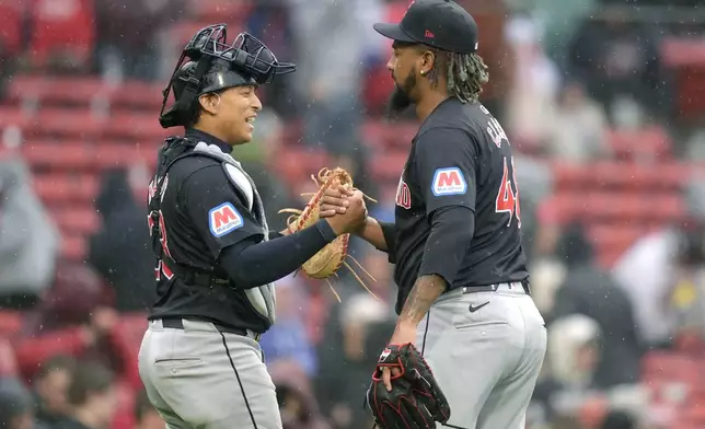 Cleveland Guardians' Bo Naylor, left, celebrates with Emmanuel Clase after Clase struck out Boston Red Sox's Triston Casas to end the baseball game, Thursday, April 18, 2024, in Boston. The Cleveland Guardians beat the Boston Red Sox. (AP Photo/Steven Senne)