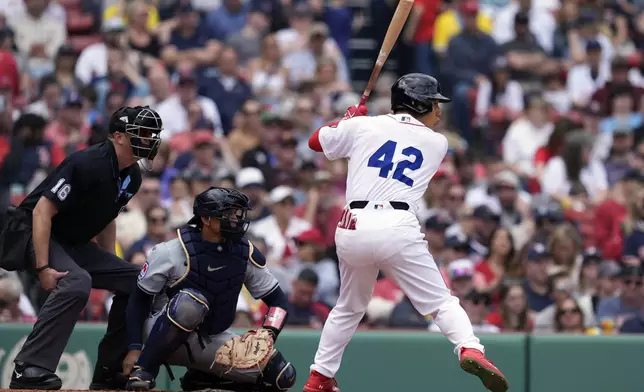Boston Red Sox's Masataka Yoshida wears the number 42 in honor of Jackie Robinson Day during the fourth inning of a baseball game against the Cleveland Guardians, Monday, April 15, 2024, in Boston. (AP Photo/Michael Dwyer)