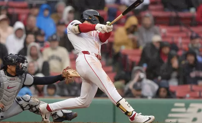Boston Red Sox's Jarren Duran hits a two-run triple in front of Cleveland Guardians' Bo Naylor, left, in the sixth inning of a baseball game, Thursday, April 18, 2024, in Boston. (AP Photo/Steven Senne)