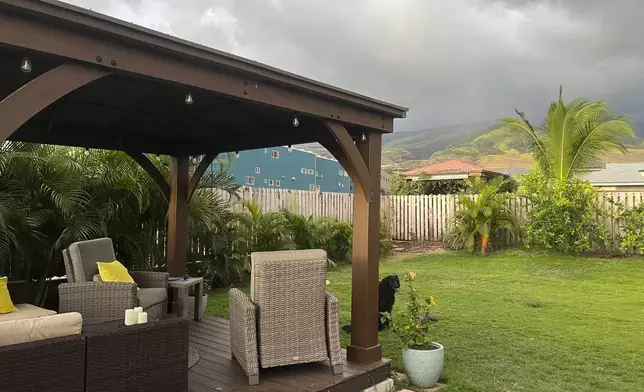 This July 2023 image provided by Amy Chadwick shows the backyard of her home in Lahaina, on the Hawaiian island of Maui. The home was destroyed in the Lahaina wildfire. Chadwick moved to Florida where she could stretch her homeowners insurance dollars. She's worried Maui's exorbitant rental prices, which she blames in part on vacation rentals hogging up limited housing supply, will hollow out her tight-knit town by similarly forcing others to leave. (Amy Chadwick via AP)