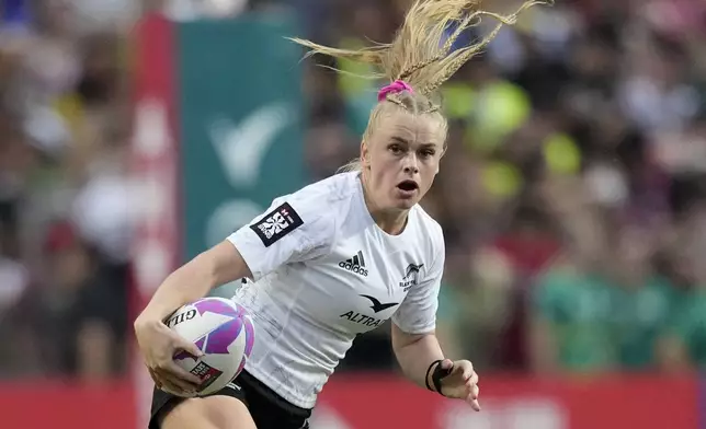 New Zealand's Jorja Miller runs with the ball during the women's final match in the Hong Kong Sevens rugby tournament in Hong Kong, Sunday, April 7, 2024. (AP Photo/Louise Delmotte)