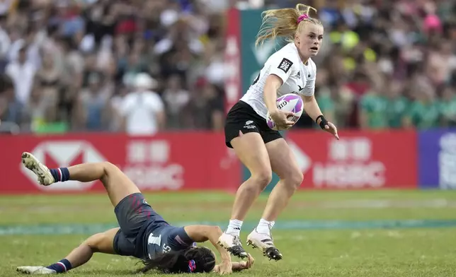New Zealand's Jorja Miller avoids a tackle during the women's final match against the United States in the Hong Kong Sevens rugby tournament in Hong Kong, Sunday, April 7, 2024. (AP Photo/Louise Delmotte)