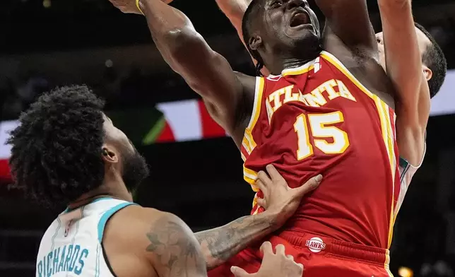 Atlanta Hawks center Clint Capela (15) shoots against Charlotte Hornets center Nick Richards (4) during the second half of an NBA basketball game, Wednesday, April 10, 2024, in Atlanta. (AP Photo/Mike Stewart)