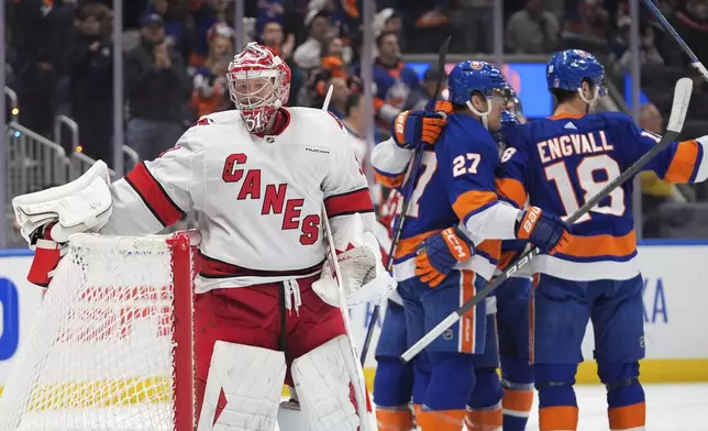 Carolina Hurricanes goaltender Frederik Andersen reacts as the New York Islanders celebrate a goal by Pierre Engvall during the second period of Game 3 of an NHL hockey Stanley Cup first-round playoff series Thursday, April 25, 2024, in Elmont, N.Y. (AP Photo/Frank Franklin II)