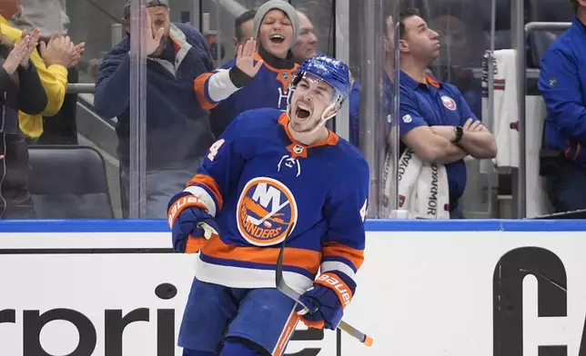 New York Islanders' Jean-Gabriel Pageau celebrates after scoring during the third period of Game 4 of an NHL hockey Stanley Cup first-round playoff series against the Carolina Hurricanes, Saturday, April 27, 2024, in Elmont, N.Y. (AP Photo/Frank Franklin II)