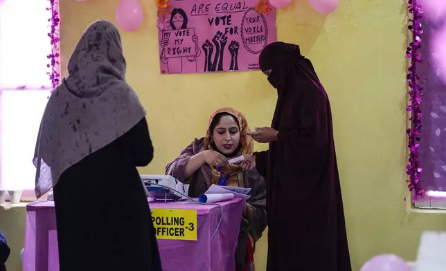 Women arrive to cast their ballots at a women only booth during the first round of polling of India’s national election in Doda district, Jammu and Kashmir, India, Friday, April 19, 2024. (AP Photo/Channi Anand)