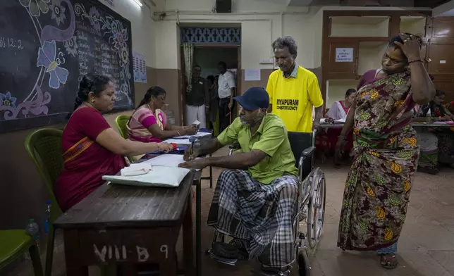 A man on a wheelchair prepares to cast vote during the first round of voting of India’s national election in Chennai, southern Tamil Nadu state, Friday, April 19, 2024. Nearly 970 million voters will elect 543 members for the lower house of Parliament for five years, during staggered elections that will run until June 1. (AP Photo/Altaf Qadri)